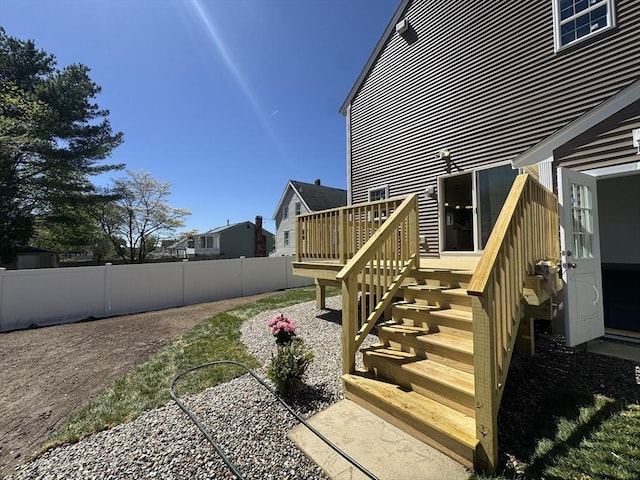 exterior space with fence and a wooden deck