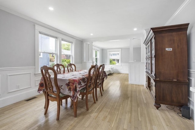 39 Pond St, Framingham, MA 01702 - dining room featuring a decorative wall, a wainscoted wall, light wood finished floors, crown molding, and recessed lighting