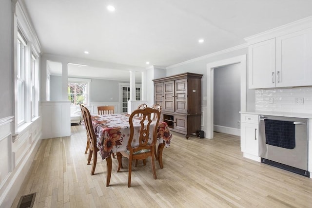 39 Pond St, Framingham, MA 01702 - dining space featuring light wood finished floors, ornamental molding, recessed lighting, a wainscoted wall, and a decorative wall