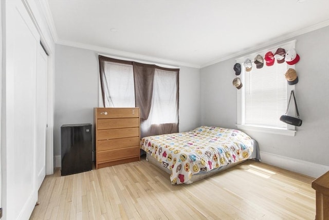 39 Pond St, Framingham, MA 01702 - bedroom featuring hardwood / wood-style flooring, crown molding, baseboards, and a closet