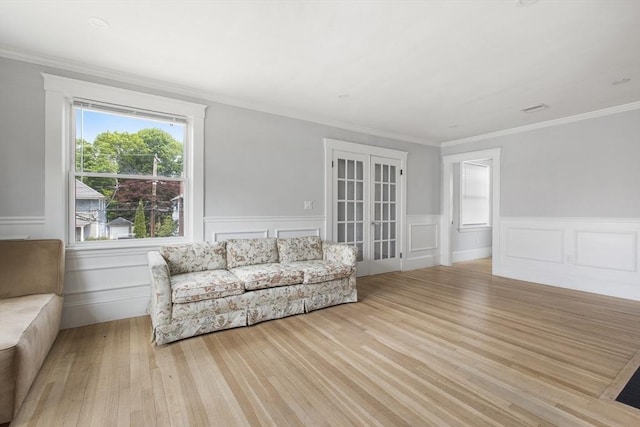39 Pond St, Framingham, MA 01702 - sitting room featuring wood finished floors, wainscoting, and crown molding