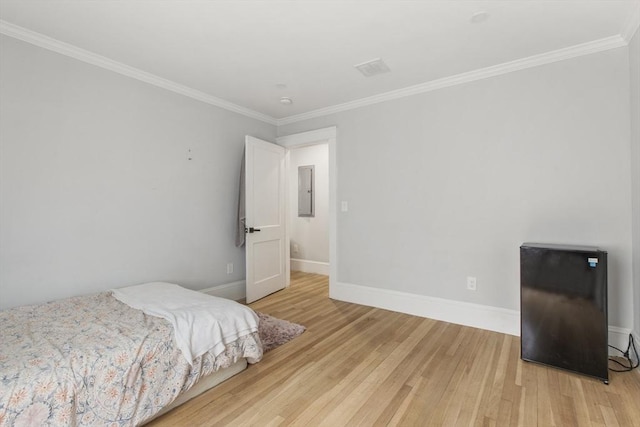 39 Pond St, Framingham, MA 01702 - bedroom featuring light wood-type flooring, ornamental molding, baseboards, and electric panel