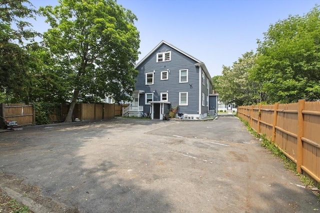 39 Pond St, Framingham, MA 01702 - rear view of property featuring uncovered parking