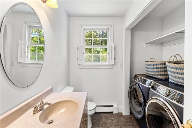497 Long Pond Rd, Plymouth, MA 02360 - bathroom featuring washing machine and clothes dryer, baseboard heating, healthy amount of natural light, and toilet