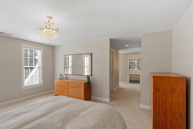 bedroom featuring light colored carpet, visible vents, baseboards, and multiple windows