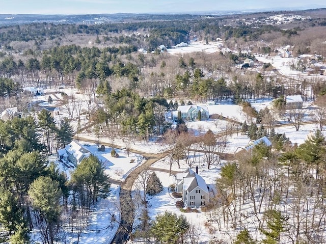 snowy aerial view with a residential view