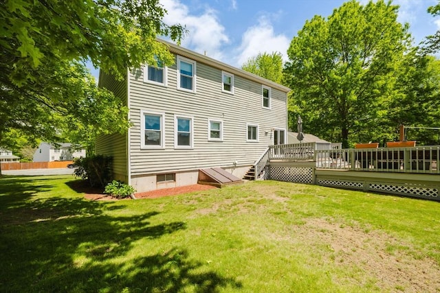 6 Gentry Ln, Taunton, MA 02780 - back of property with a wooden deck and a lawn