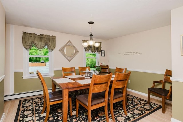 6 Gentry Ln, Taunton, MA 02780 - dining area with light wood-style floors, a chandelier, and a baseboard radiator