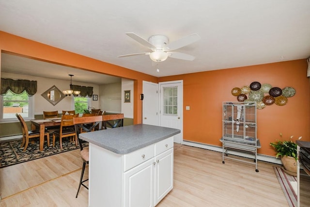6 Gentry Ln, Taunton, MA 02780 - kitchen with light wood-style flooring, a center island, white cabinetry, ceiling fan, and a chandelier