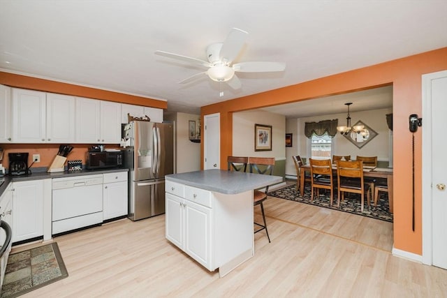 6 Gentry Ln, Taunton, MA 02780 - kitchen featuring stainless steel refrigerator with ice dispenser, black microwave, dishwasher, a breakfast bar area, and light wood-style flooring