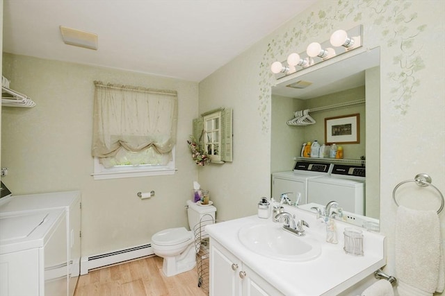 6 Gentry Ln, Taunton, MA 02780 - bathroom with independent washer and dryer, a baseboard radiator, vanity, wood finished floors, and toilet