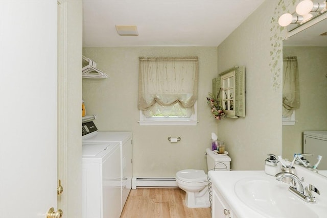 6 Gentry Ln, Taunton, MA 02780 - bathroom featuring washing machine and dryer, a baseboard radiator, vanity, wood finished floors, and toilet