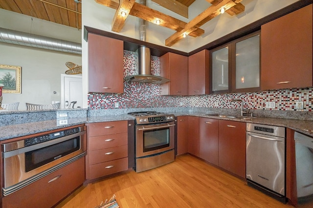 kitchen with stainless steel appliances, backsplash, light hardwood / wood-style floors, and beamed ceiling