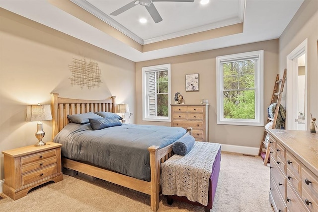 bedroom featuring ornamental molding, light colored carpet, baseboards, a tray ceiling, and recessed lighting