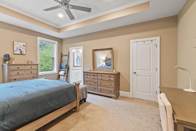 bedroom featuring ornamental molding, light colored carpet, recessed lighting, baseboards, and a tray ceiling