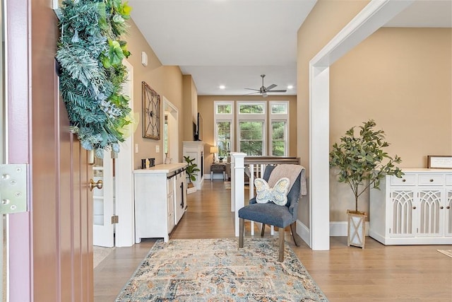 entrance foyer featuring ceiling fan, light wood-style flooring, recessed lighting, and baseboards