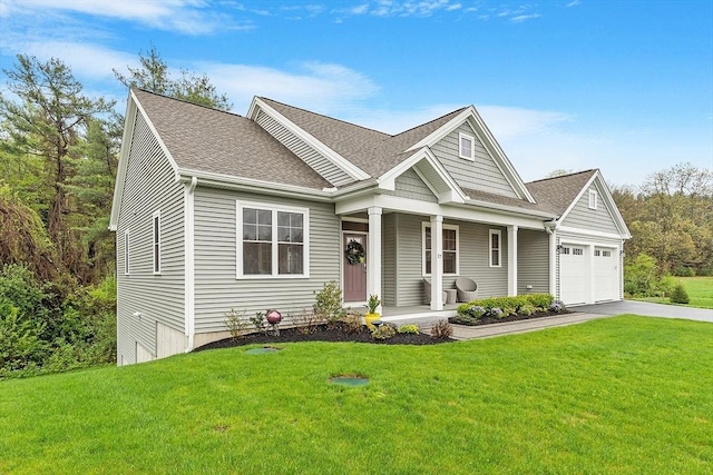 craftsman inspired home with a porch, driveway, a front yard, and roof with shingles