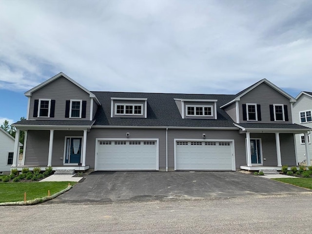 view of front of property with a garage and a porch