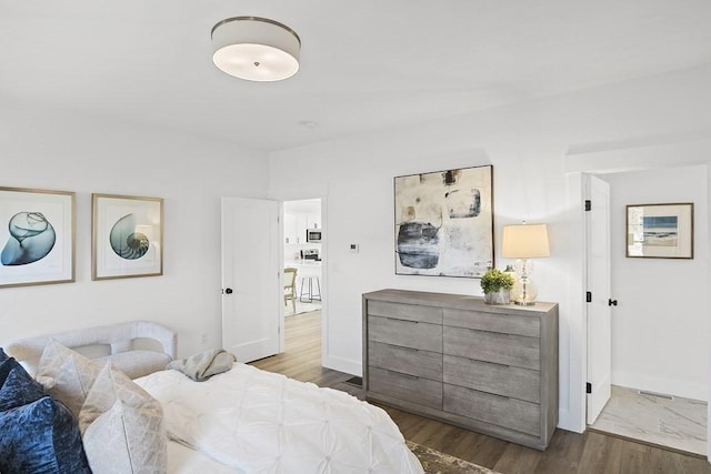 bedroom featuring wood-type flooring