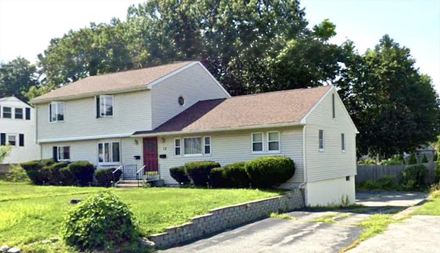 13 Ridgewood Cir, Lawrence, NY 10843 - view of front of house with a front lawn