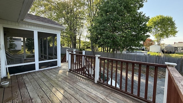 13 Ridgewood Cir, Lawrence, NY 10843 - deck with a fenced backyard and a sunroom