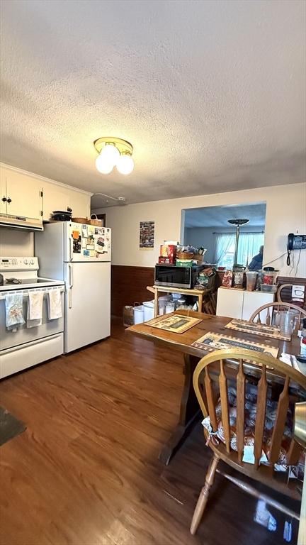 13 Ridgewood Cir, Lawrence, NY 10843 - dining room with wood finished floors and a textured ceiling