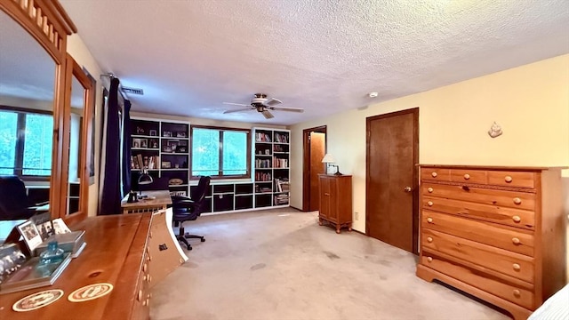 13 Ridgewood Cir, Lawrence, NY 10843 - office space featuring light colored carpet, a ceiling fan, a textured ceiling, and built in features