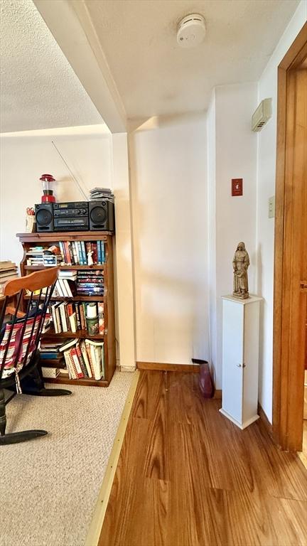 13 Ridgewood Cir, Lawrence, NY 10843 - office area featuring wood finished floors and a textured ceiling