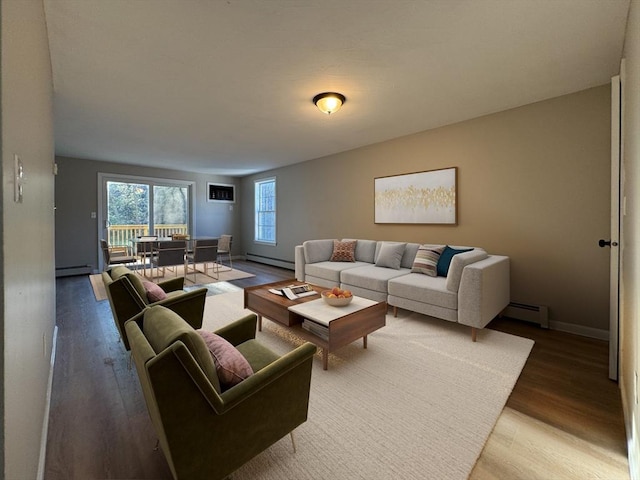 living room featuring hardwood / wood-style floors and baseboard heating