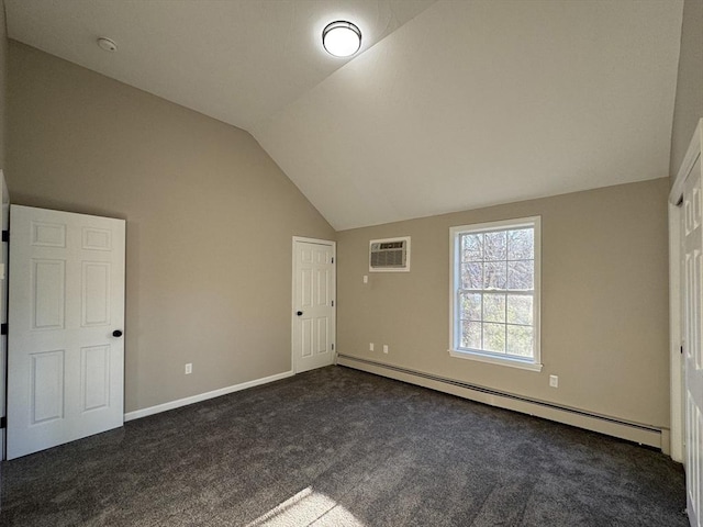 unfurnished bedroom featuring vaulted ceiling, an AC wall unit, dark carpet, and a baseboard heating unit