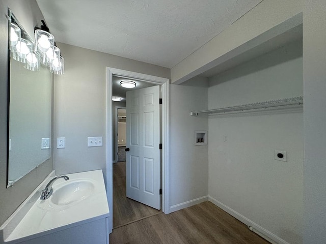 bathroom with wood-type flooring and vanity