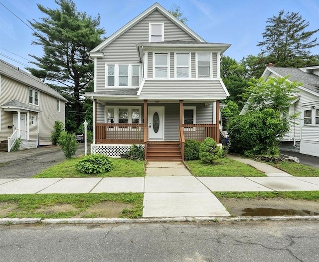 31-33 Dorset St, Springfield, MA 01108 - american foursquare style home featuring a porch