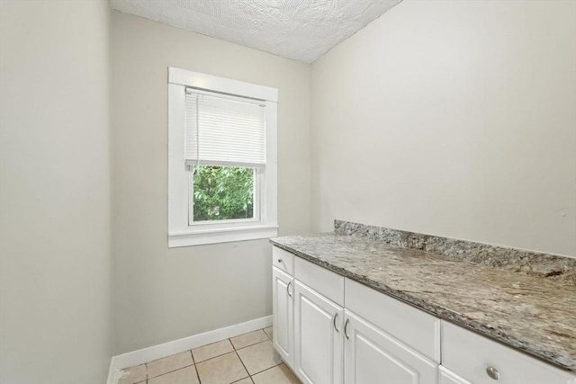 31-33 Dorset St, Springfield, MA 01108 - bathroom with tile patterned flooring, a textured ceiling, and vanity