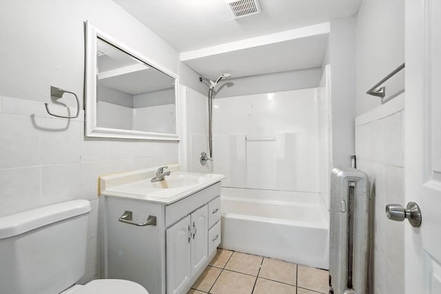 31-33 Dorset St, Springfield, MA 01108 - full bathroom featuring vanity, tile walls, bathtub / shower combination, and tile patterned flooring