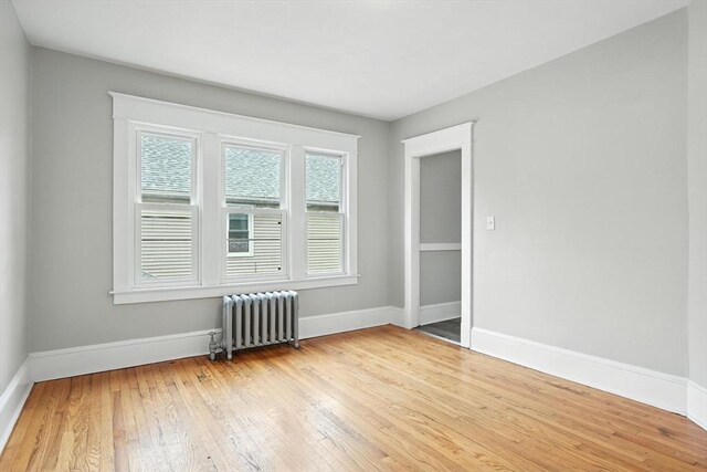 31-33 Dorset St, Springfield, MA 01108 - empty room featuring radiator and hardwood / wood-style floors