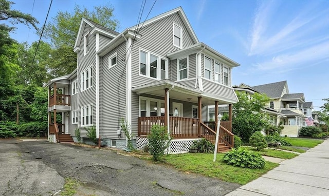 31-33 Dorset St, Springfield, MA 01108 - view of front of house with covered porch and a balcony