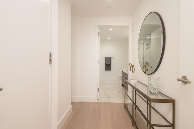 hall with light hardwood / wood-style flooring