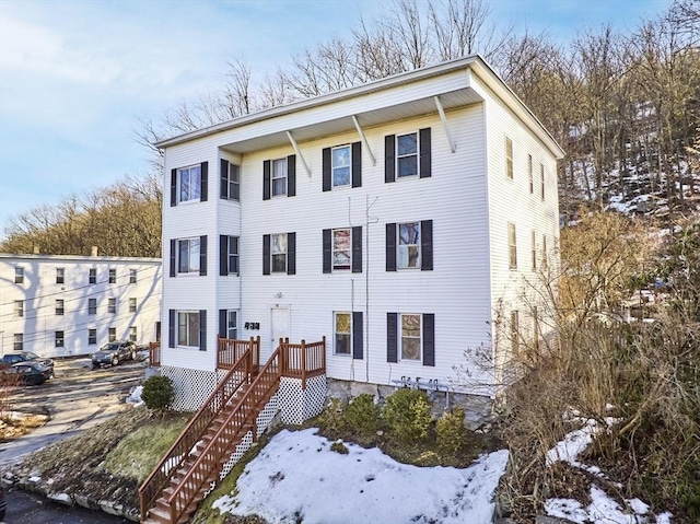 view of front of property with stairway