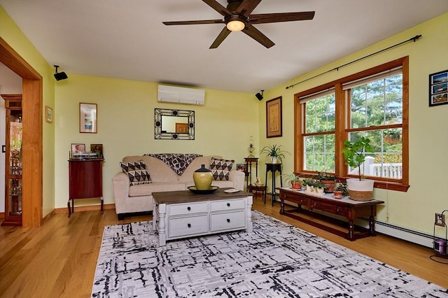 43 Ridge Rd, Erving, MA 01344 - living room featuring a wall mounted AC, ceiling fan, and light wood-type flooring
