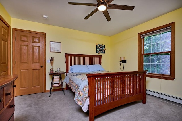 43 Ridge Rd, Erving, MA 01344 - carpeted bedroom featuring a baseboard heating unit and a ceiling fan