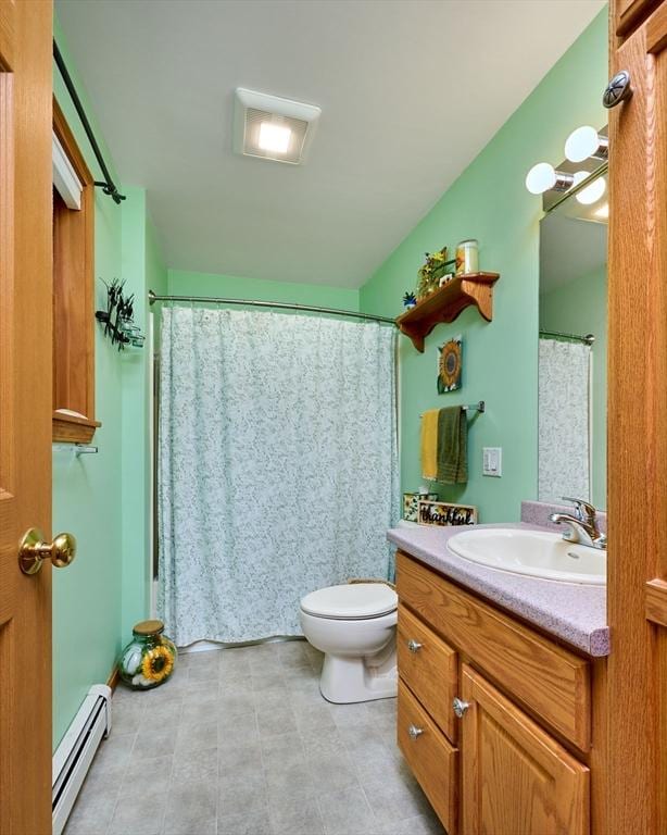 43 Ridge Rd, Erving, MA 01344 - bathroom featuring a baseboard radiator, vanity, toilet, a shower with curtain, and tile patterned flooring
