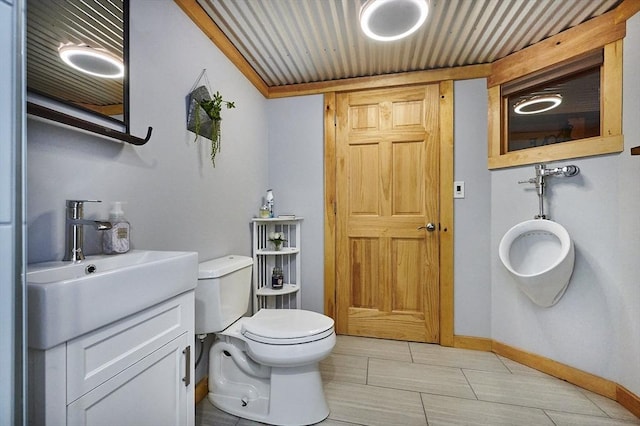 43 Ridge Rd, Erving, MA 01344 - bathroom featuring toilet, vanity, and baseboards