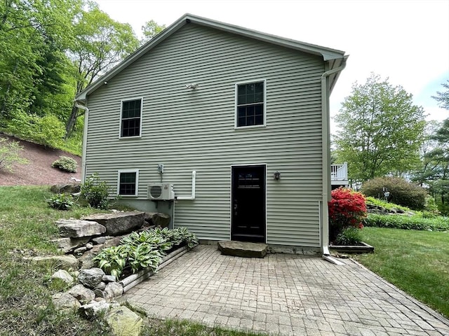 43 Ridge Rd, Erving, MA 01344 - back of property with a cooling unit, a patio area, and a lawn
