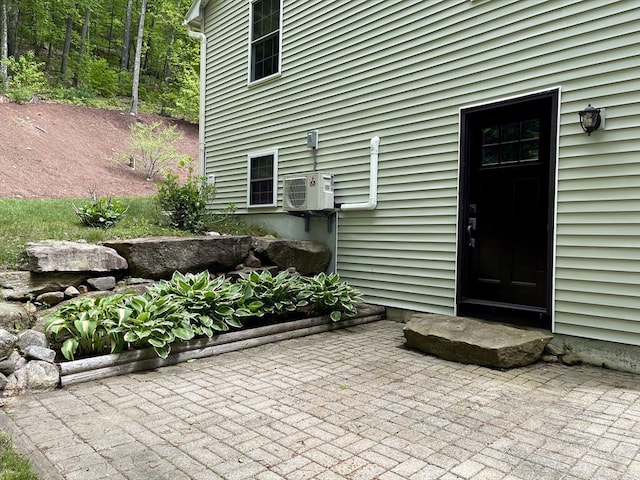 43 Ridge Rd, Erving, MA 01344 - view of exterior entry featuring a cooling unit and a patio
