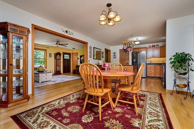 43 Ridge Rd, Erving, MA 01344 - dining area with light wood-type flooring and a chandelier