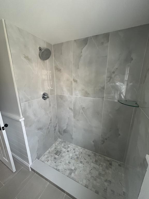 23 Town Hall Ave, Yarmouth, MA 02664 - bathroom featuring tile patterned flooring and tiled shower