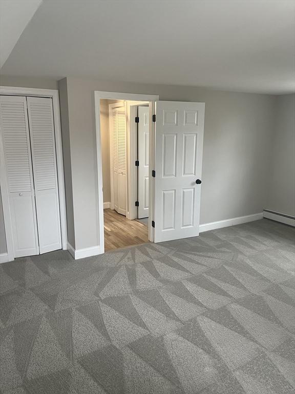 23 Town Hall Ave, Yarmouth, MA 02664 - unfurnished bedroom featuring baseboards, carpet floors, and a closet
