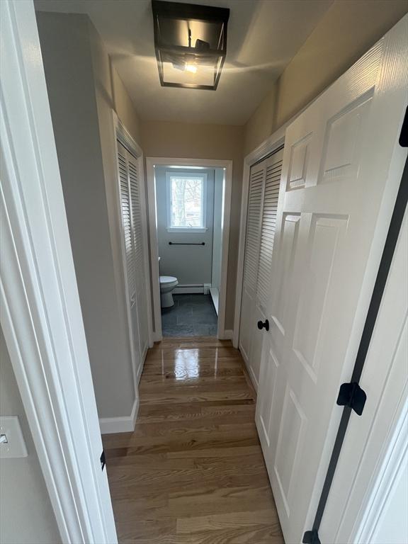 23 Town Hall Ave, Yarmouth, MA 02664 - corridor with baseboards and wood finished floors