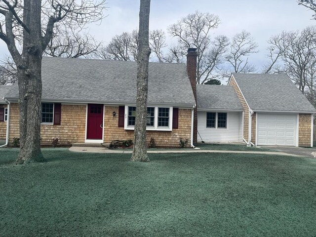 23 Town Hall Ave, Yarmouth, MA 02664 - view of front of home featuring an attached garage, a front lawn, and a chimney