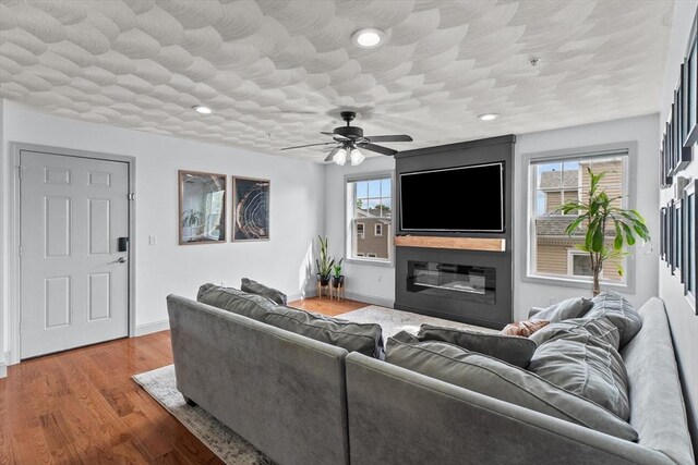12 School St Unit 3, Salem, MA 01970 - living area with healthy amount of natural light, ceiling fan, wood finished floors, baseboards, and recessed lighting